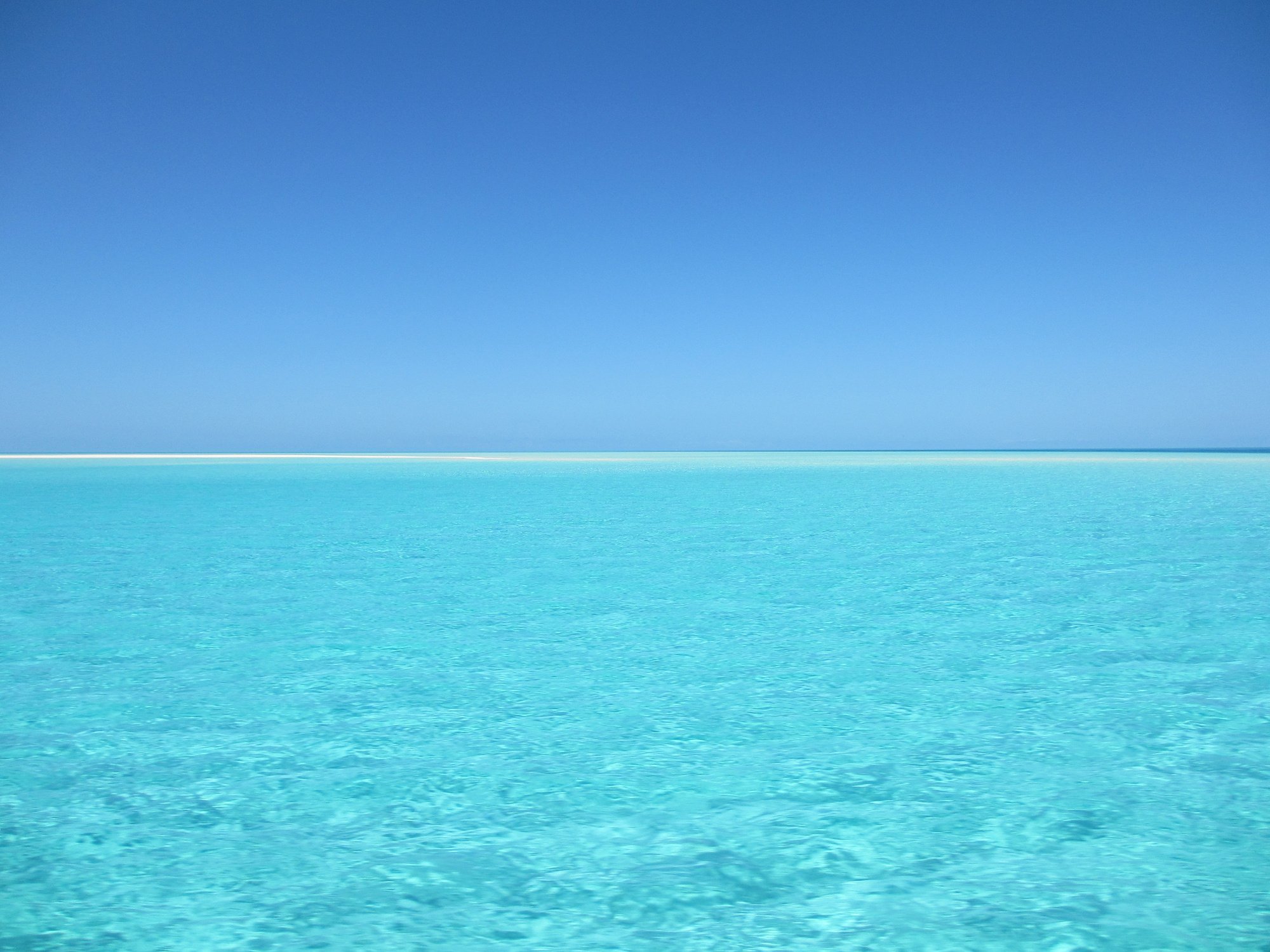 Blue and White Ocean during Day Time